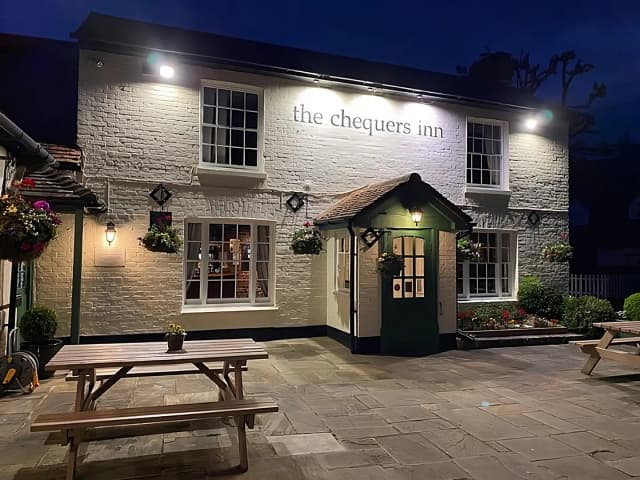 Exterior shot of the Chequers Inn gastro-pub at night